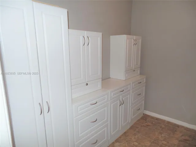 a spacious bathroom with a double vanity sink and a mirror