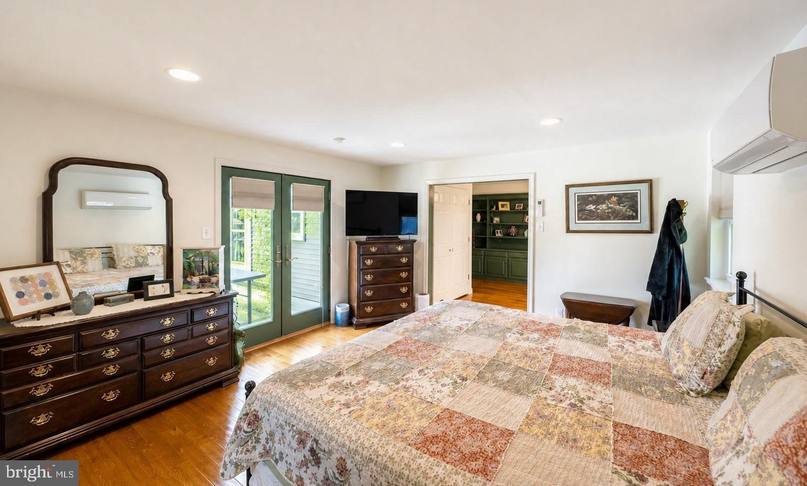 222 Blue School Road Perkasie, PA 18944 - Photo 26 of 77 a bedroom with a bed and a large mirror on the dresser