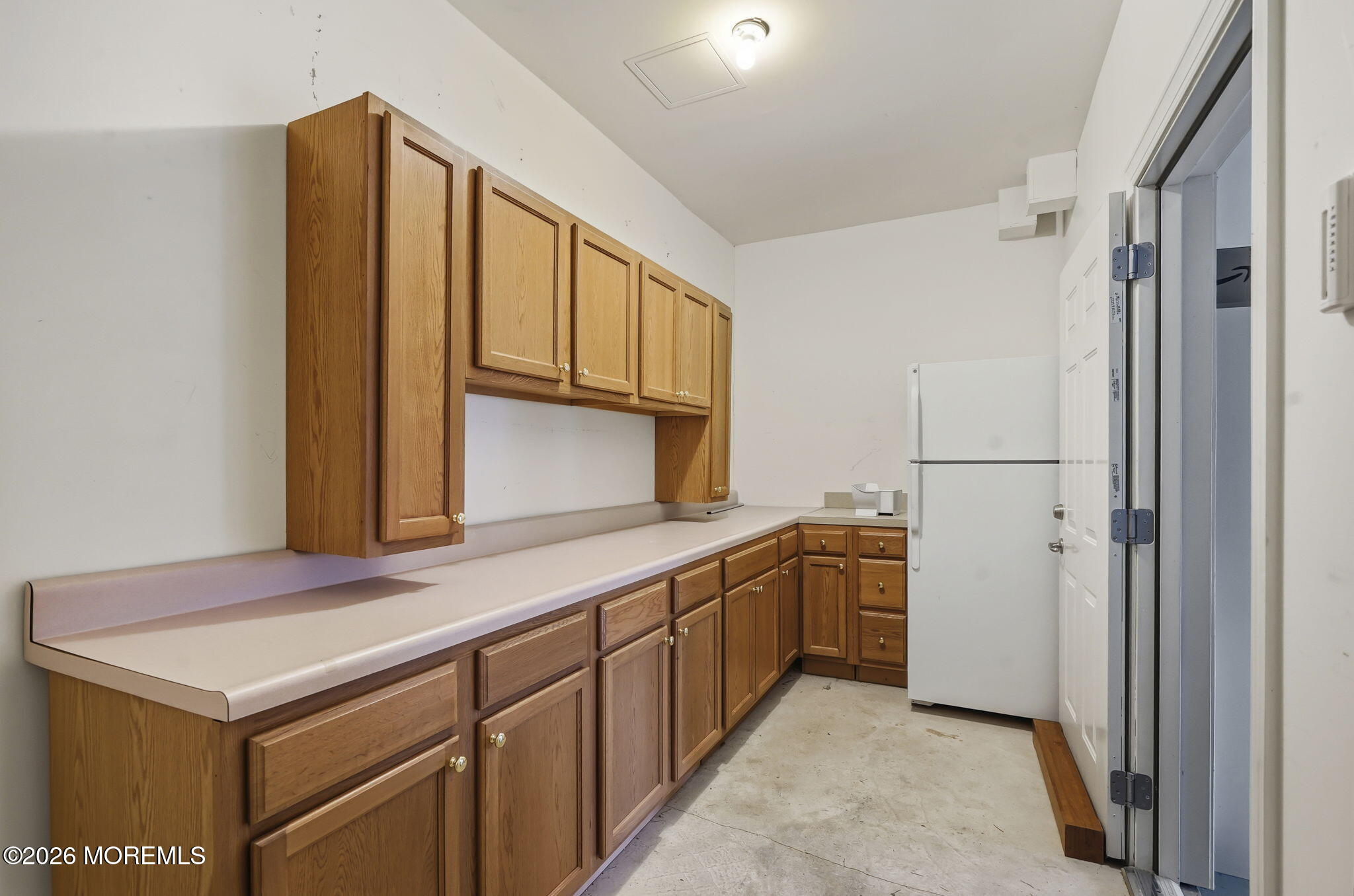 106 Potts Road Morganville, NJ 07751 - Photo 22 of 25 a kitchen with stainless steel appliances granite countertop a refrigerator and a stove