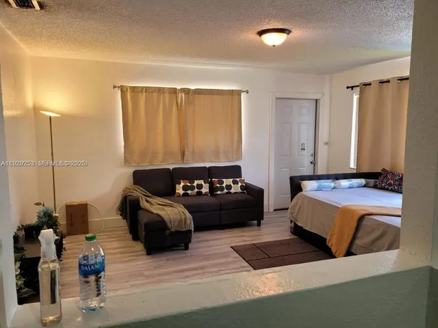 a bathroom with a toilet and a bathtub