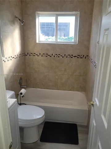 a bedroom with a bed and a desk