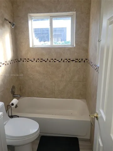 a living room with a wooden floor