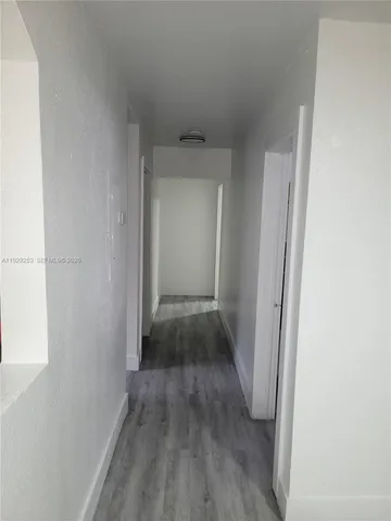a view of cabinets and wooden floor