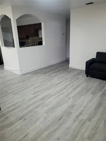 a view of a living room and dining room