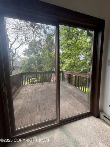a view of a glass door with a wooden floor