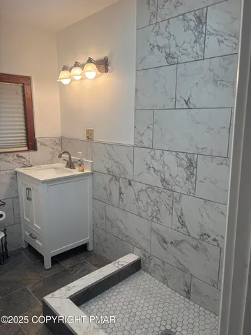 a bathroom with a sink a vanity and a mirror