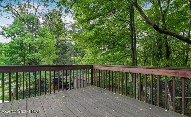 a view of balcony with wooden floor