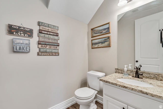 2543 East 700 South Springville, UT 84663 - Photo 22 of 73 Bathroom featuring vanity, lofted ceiling, and wood finished floors