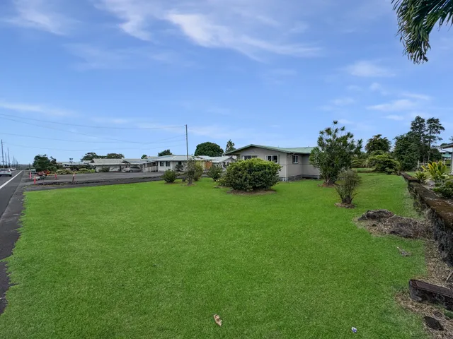 a view of a garden with houses