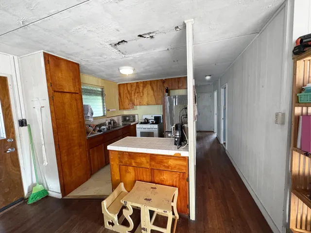a very nice looking dining room with a large window