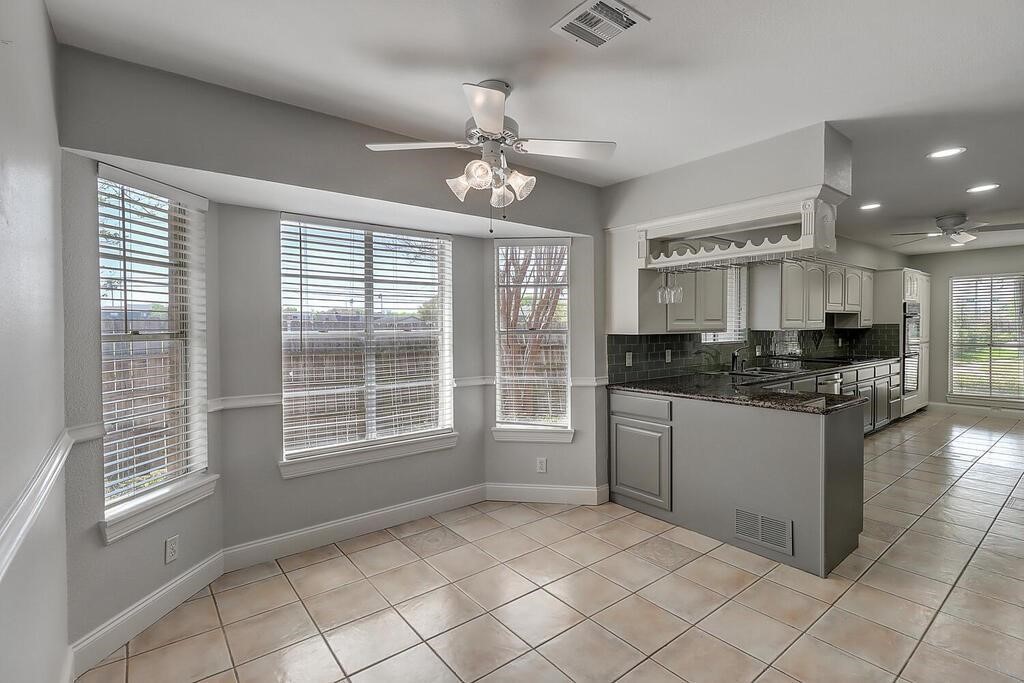 6426 Long Circle Corpus Christi, TX 78413 - Photo 16 of 40 a kitchen with a refrigerator a sink and cabinets