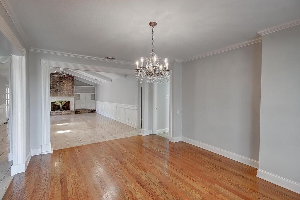 6426 Long Circle Corpus Christi, TX 78413 - Photo 20 of 40 a view of a room with wooden floor chandelier and a window