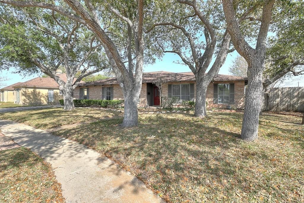 6426 Long Circle Corpus Christi, TX 78413 - Photo 2 of 40 a front view of a house with a yard