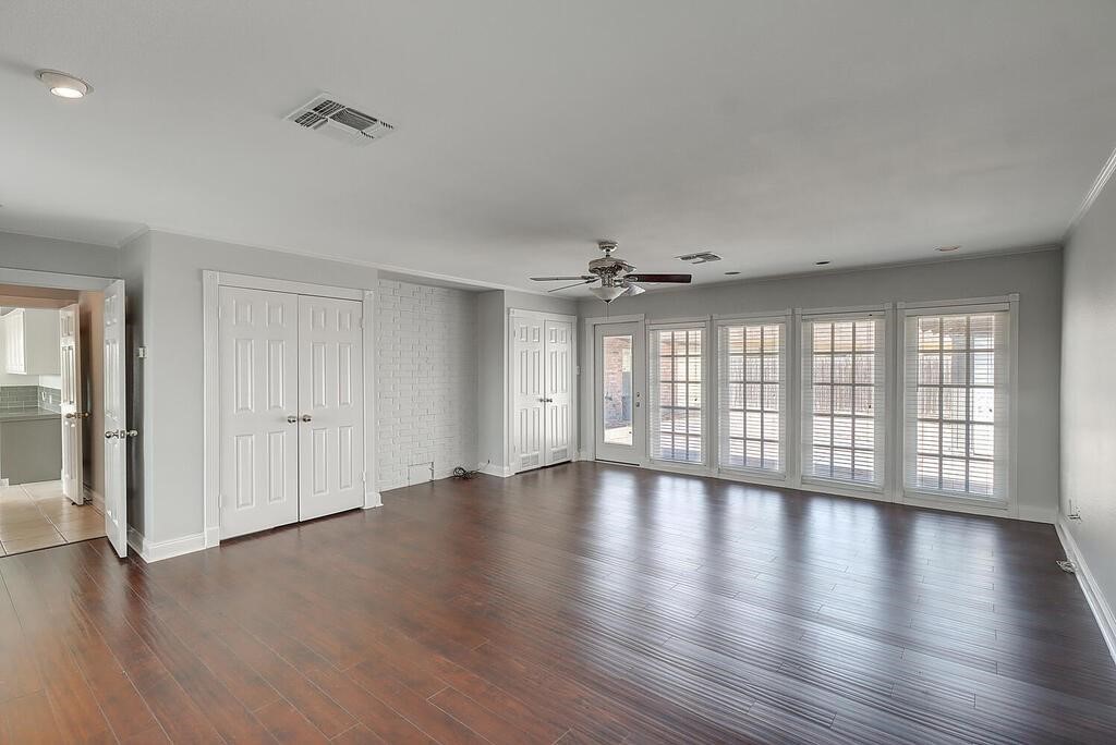 6426 Long Circle Corpus Christi, TX 78413 - Photo 24 of 40 a view of an empty room with wooden floor and a window