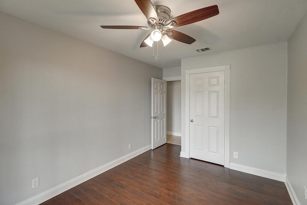 6426 Long Corpus Christi, TX 78413 - Photo 25 of 37 an empty room with wooden floor and ceiling fan