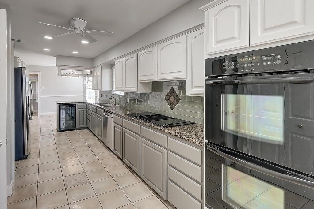 6426 Long Circle Corpus Christi, TX 78413 - Photo 3 of 40 a kitchen with stainless steel appliances granite countertop a sink and cabinets