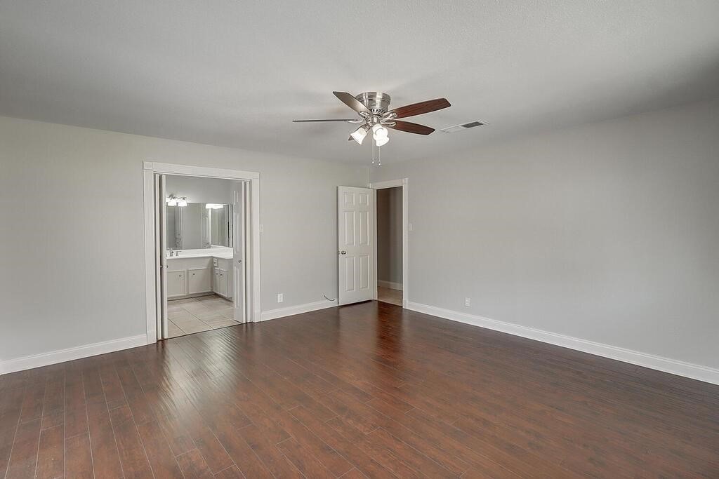 6426 Long Circle Corpus Christi, TX 78413 - Photo 31 of 40 a view of an empty room with a window and wooden floor