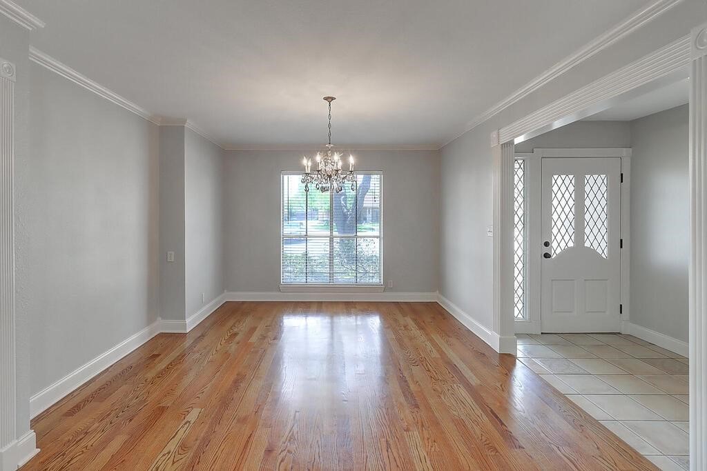 6426 Long Circle Corpus Christi, TX 78413 - Photo 5 of 40 wooden floor in an empty room with a window