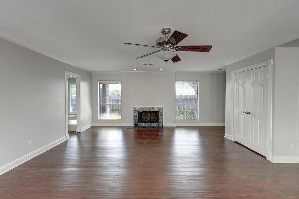 6426 Long Circle Corpus Christi, TX 78413 - Photo 7 of 40 a view of empty room with wooden floor and fireplace