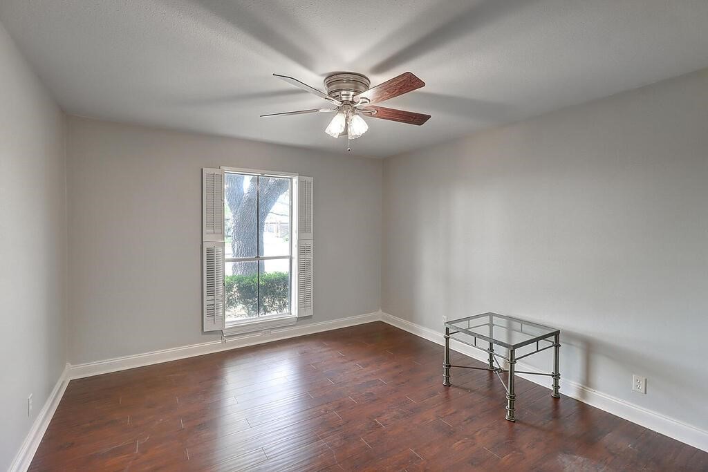 6426 Long Circle Corpus Christi, TX 78413 - Photo 10 of 40 a view of an empty room with window and wooden floor