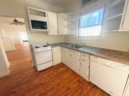 a kitchen with a stove and a microwave