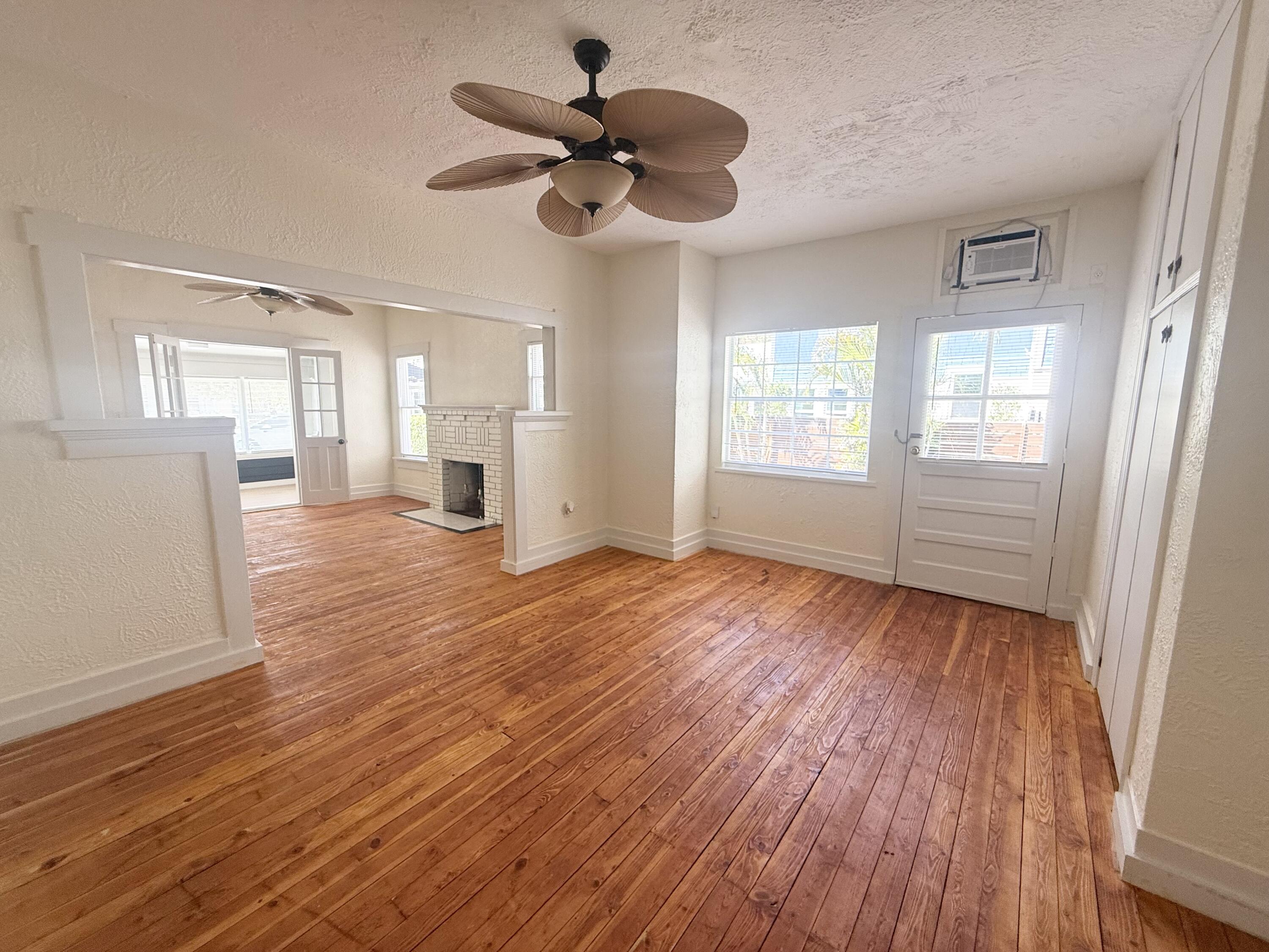 311 Wildermere Road West Palm Beach, FL 33401 - Photo 17 of 87 a view of a livingroom with wooden floor and a ceiling fan