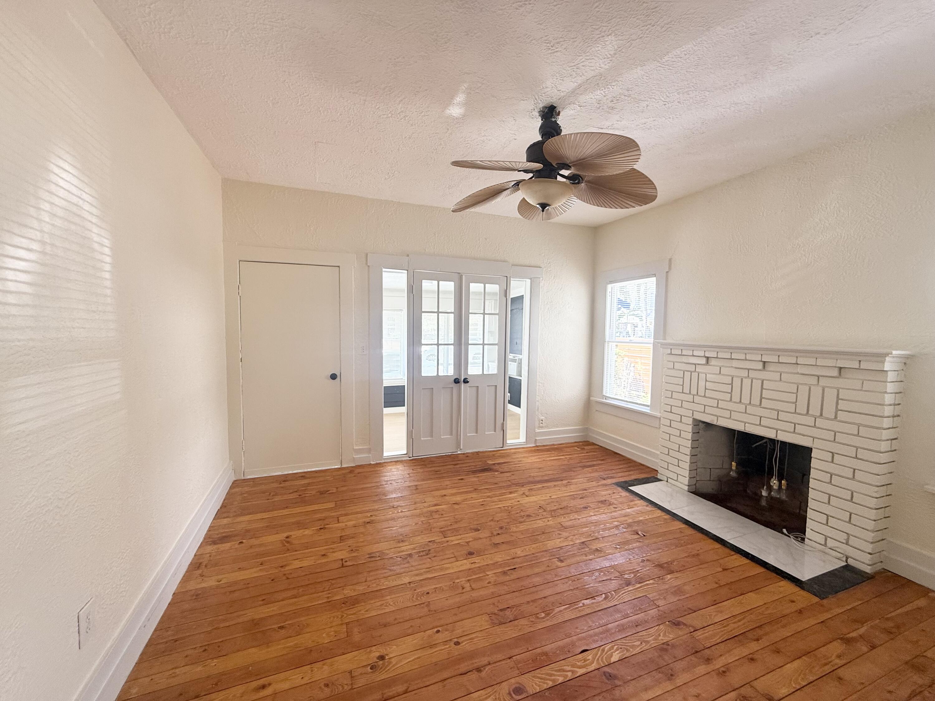 311 Wildermere Road West Palm Beach, FL 33401 - Photo 20 of 87 a view of an empty room with window and wooden floor