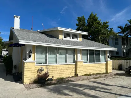 a front view of a house with a garage