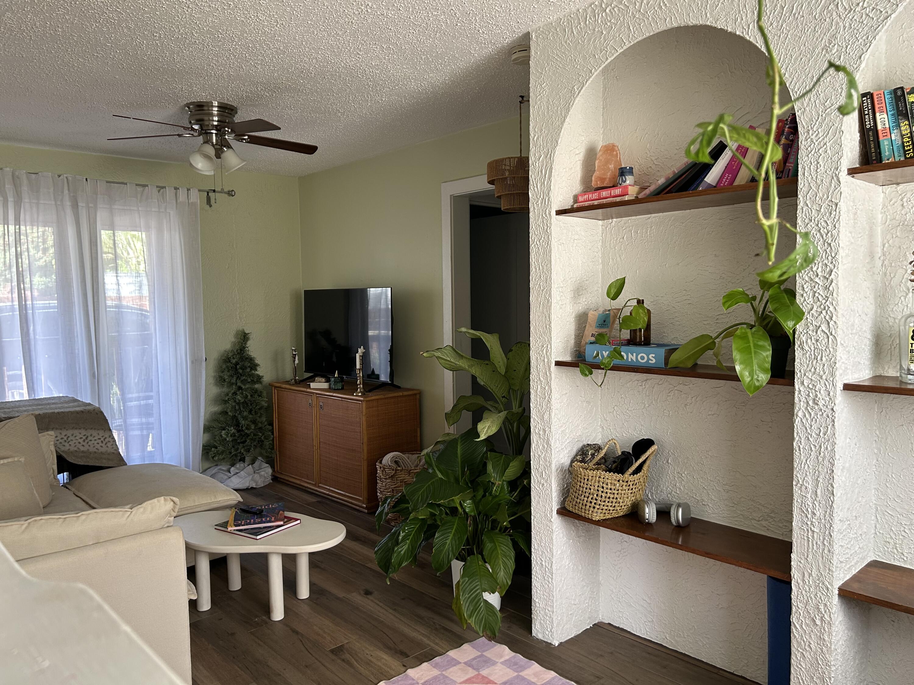 311 Wildermere Road West Palm Beach, FL 33401 - Photo 54 of 87 a living room with furniture and a potted plant