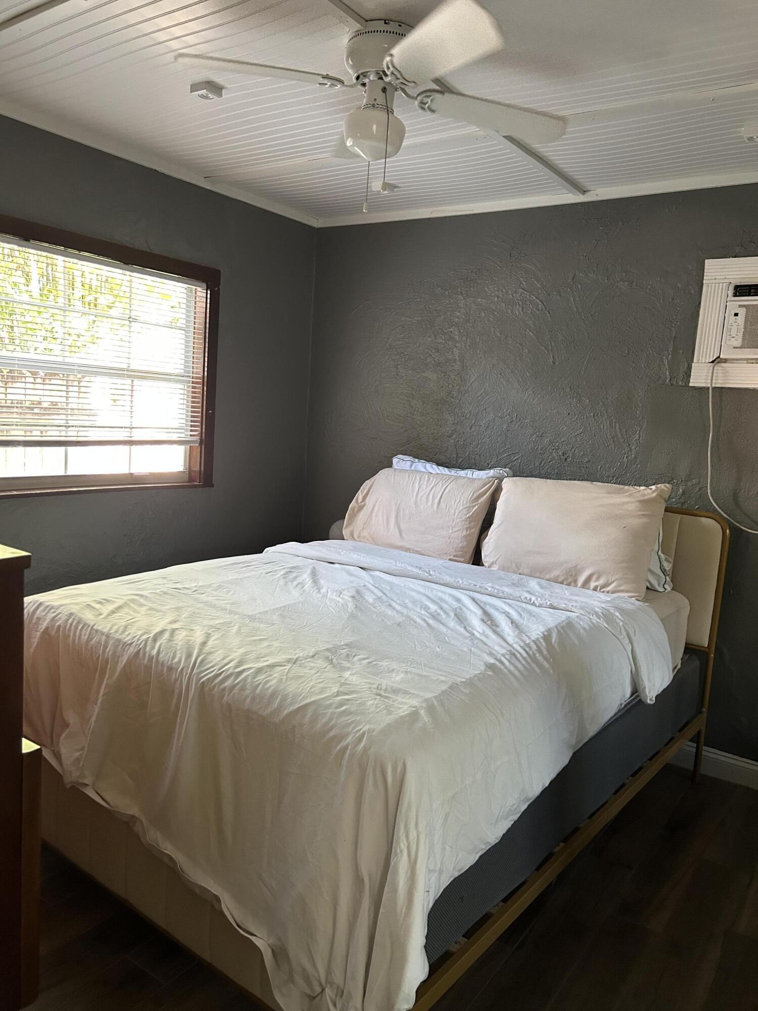 311 Wildermere Road West Palm Beach, FL 33401 - Photo 56 of 87 a bedroom with a bed and window