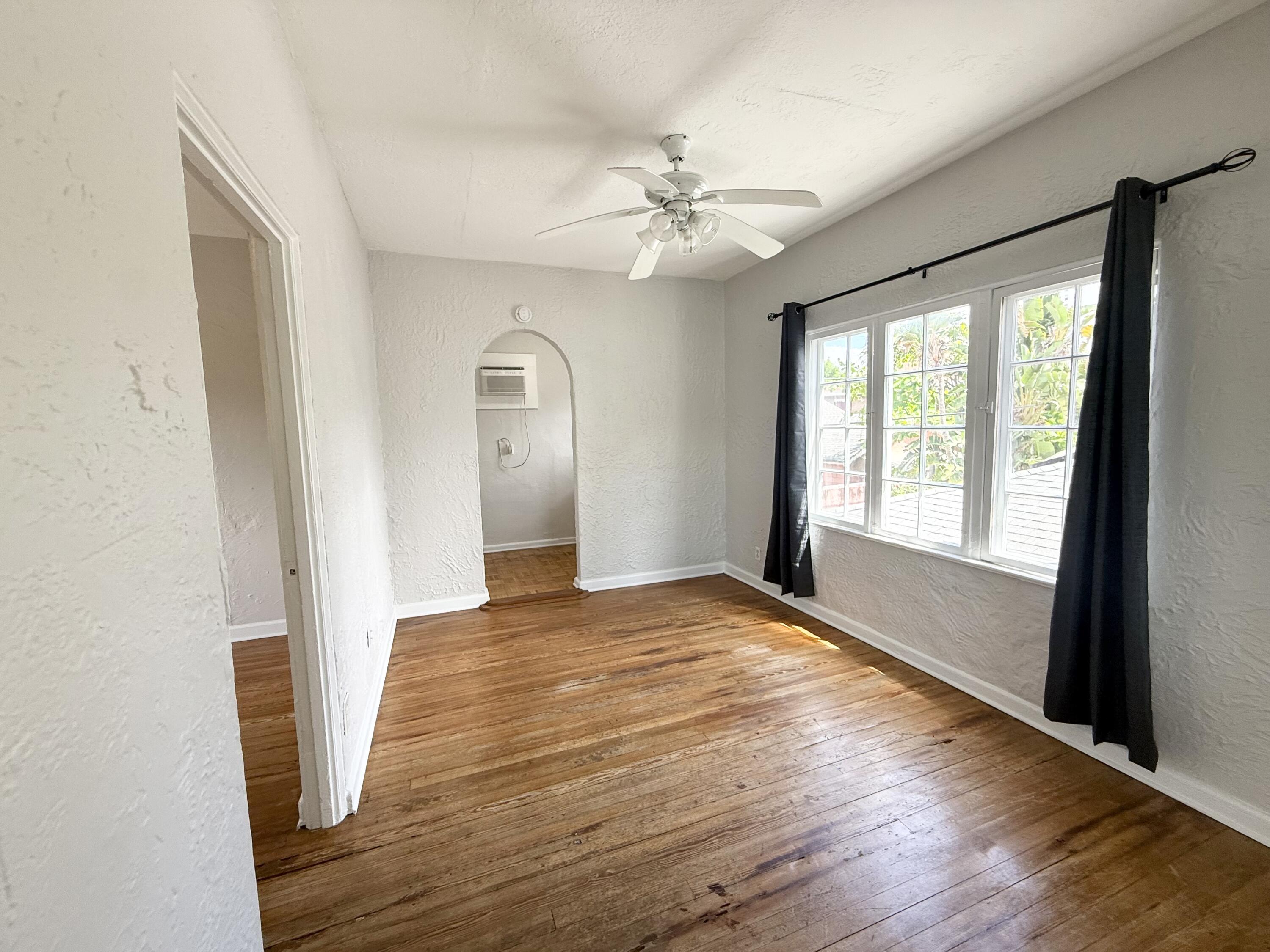 311 Wildermere Road West Palm Beach, FL 33401 - Photo 68 of 87 a view of an empty room with wooden floor and a window