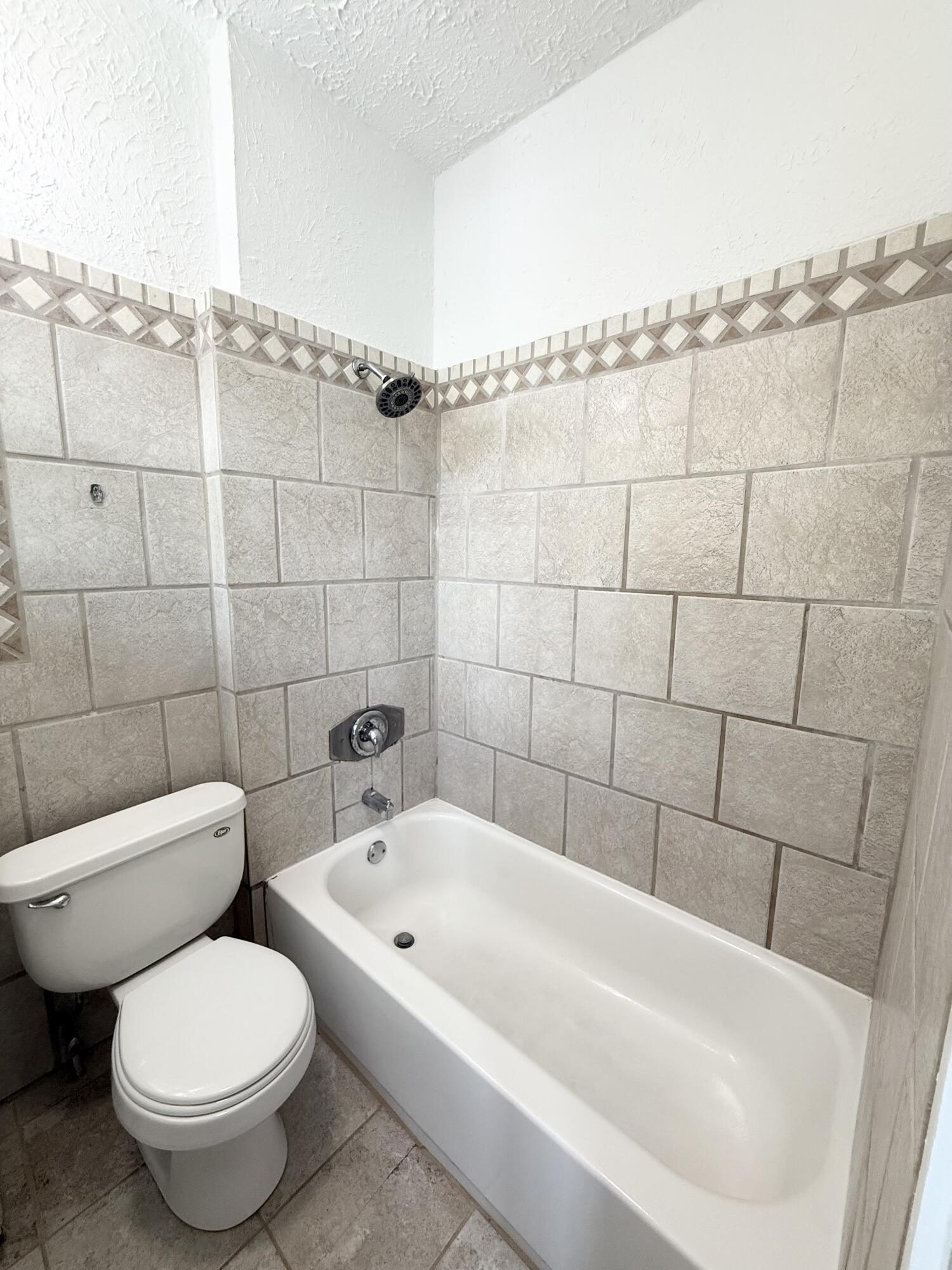 311 Wildermere Road West Palm Beach, FL 33401 - Photo 76 of 87 a white bath tub sitting next to a white toilet