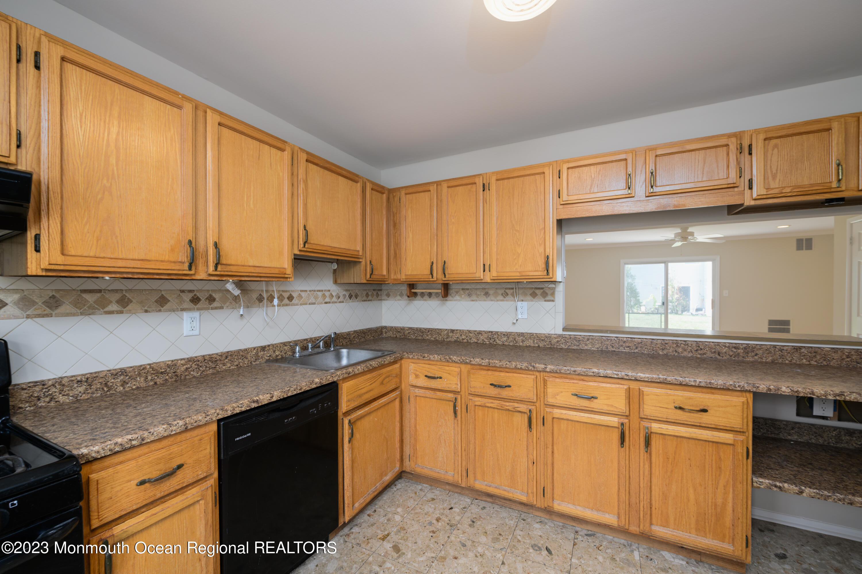 60 County Road, Unit J64 Cliffwood, NJ 07721 - Photo 3 of 21 a kitchen with granite countertop cabinets stainless steel appliances a sink and window
