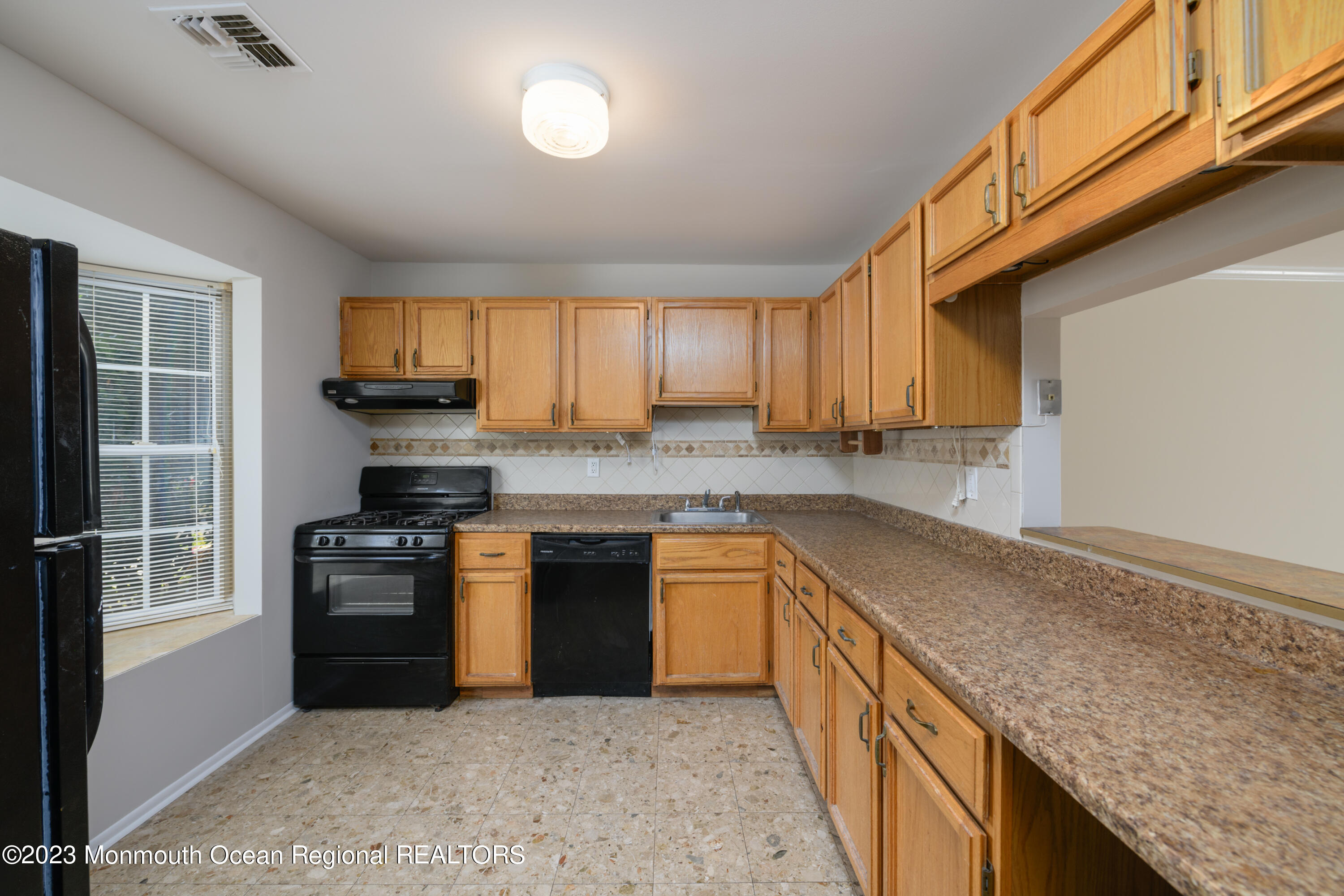 60 County Road, Unit J64 Cliffwood, NJ 07721 - Photo 5 of 21 a kitchen with stainless steel appliances granite countertop a stove a sink and a refrigerator
