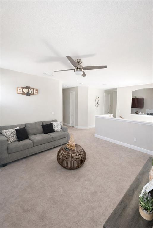 1216 Old Windsor Way Spring Hill, FL 34609 - Photo 18 of 31 a living room with furniture and a wooden floor