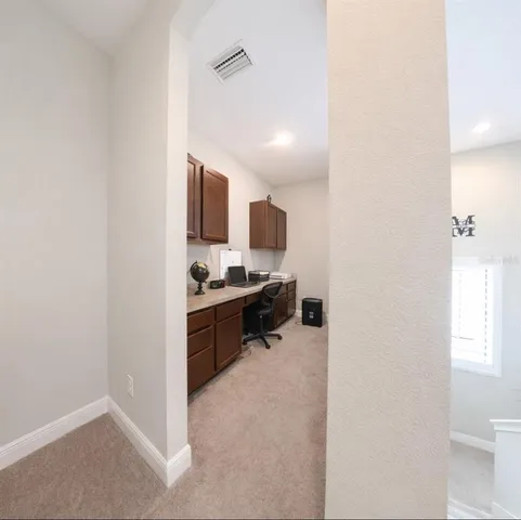 a kitchen with sink cabinets and microwave