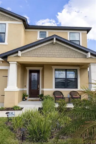 a front view of a house with garden
