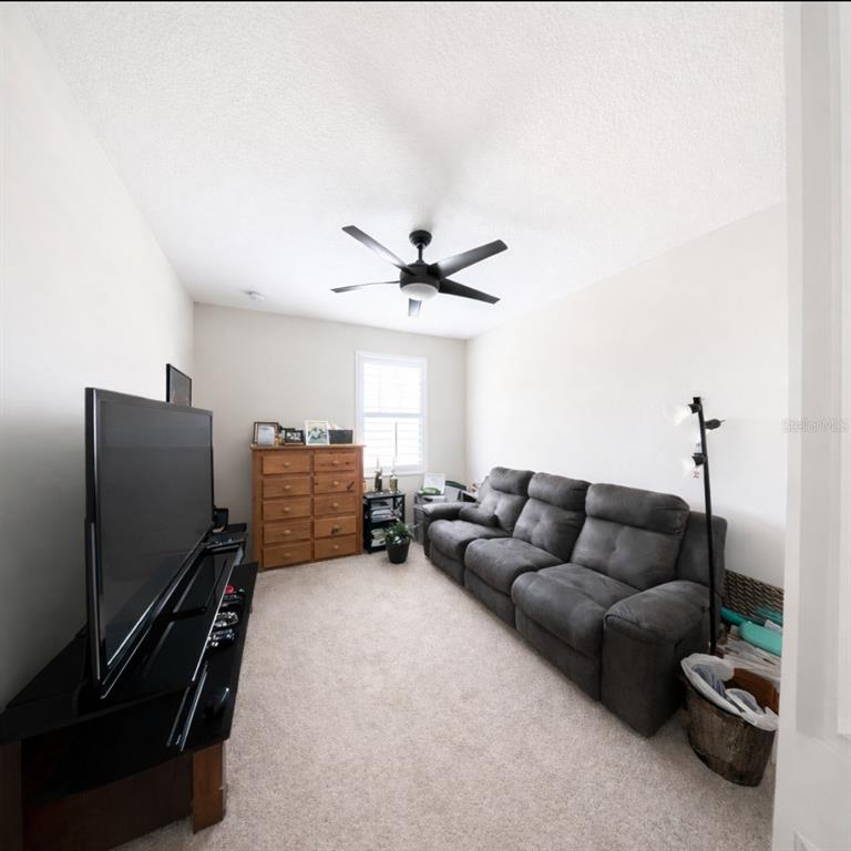 1216 Old Windsor Way Spring Hill, FL 34609 - Photo 28 of 31 a living room with furniture