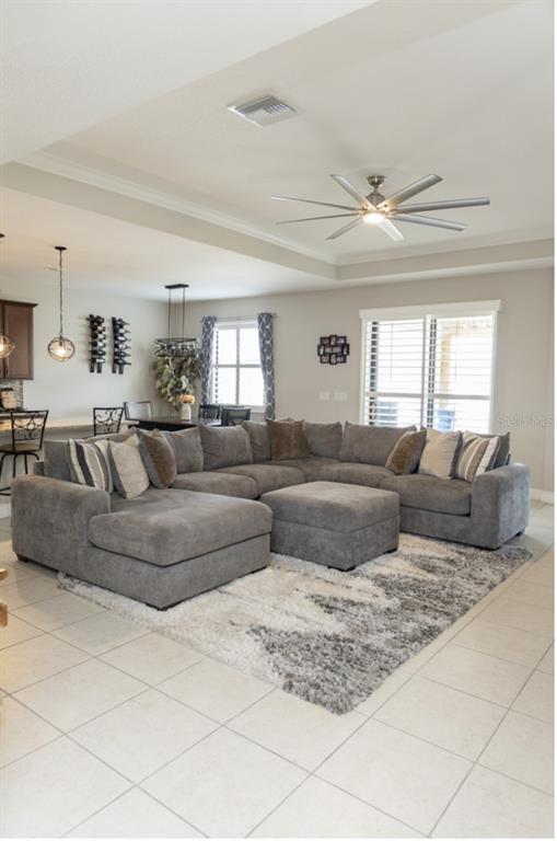 1216 Old Windsor Way Spring Hill, FL 34609 - Photo 6 of 31 a living room with furniture and a large window