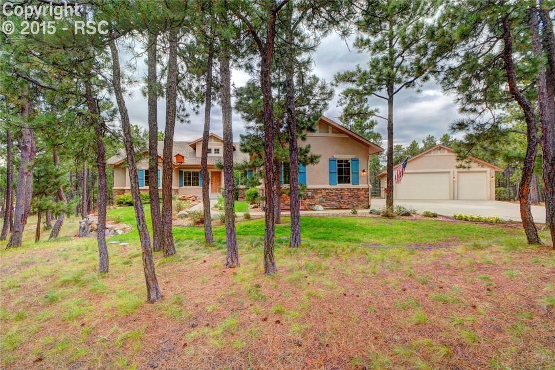 4241 High Forest Road Colorado Springs, CO 80908 - Photo 1 of 18 Stunning Ranch Style Home Nestled in the Trees!
