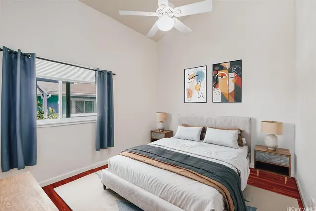 a bedroom with a bed and a painting on the wall