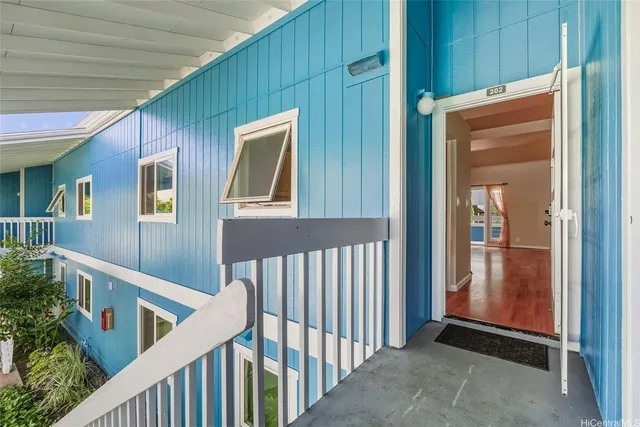 a view of a swimming pool with a patio and a yard