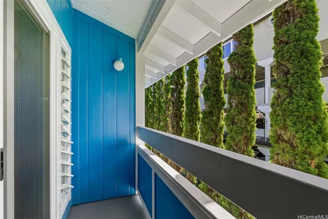 a view of balcony with wooden floor