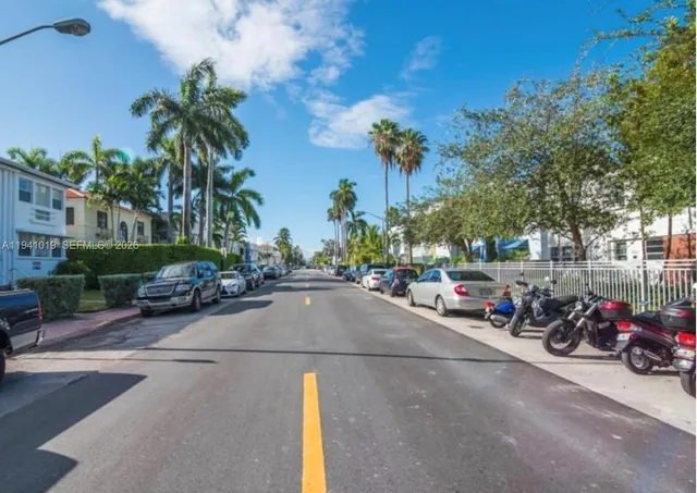 a view of a street with cars