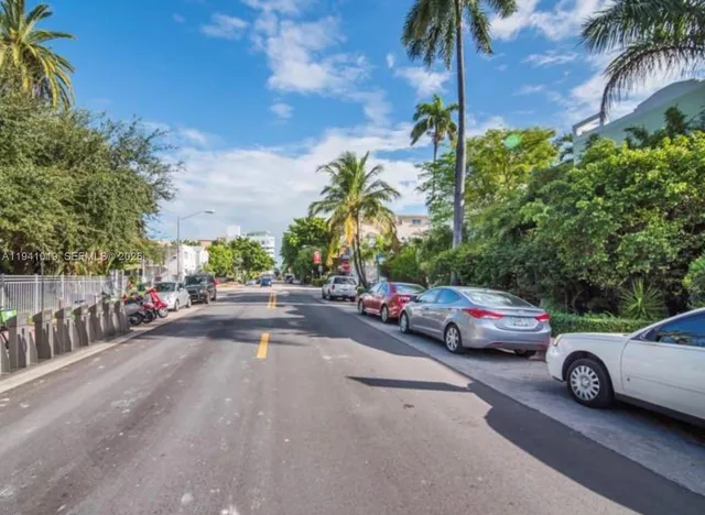 a view of street with parked cars