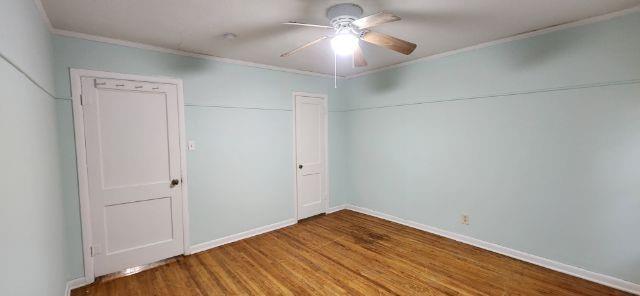 108 East Maple Street Keene, TX 76059 - Photo 9 of 14 a view of empty room with wooden floor
