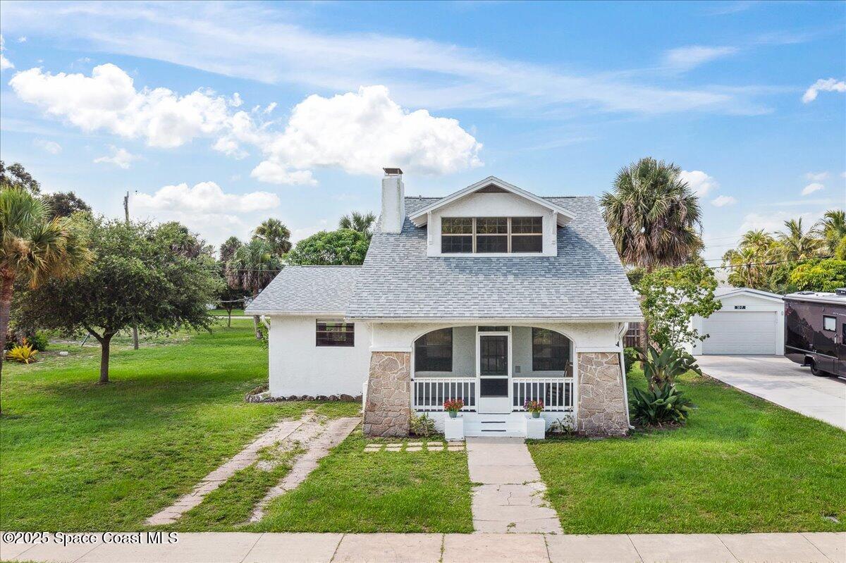 415 2nd Avenue Indialantic, FL 32903 - Photo 1 of 51 a front view of a house with a yard