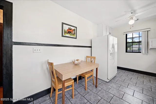 a view of a dining area with furniture and window