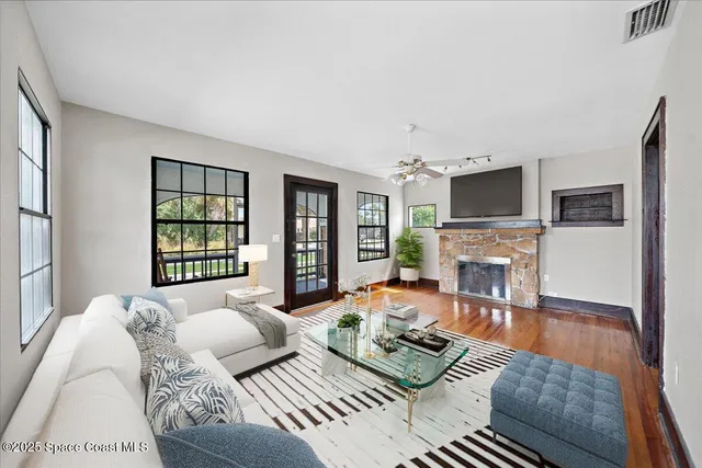 a bedroom with furniture fireplace and flat screen tv