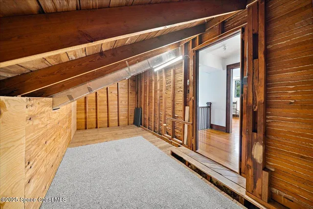 a view of bathroom with a sink and mirror